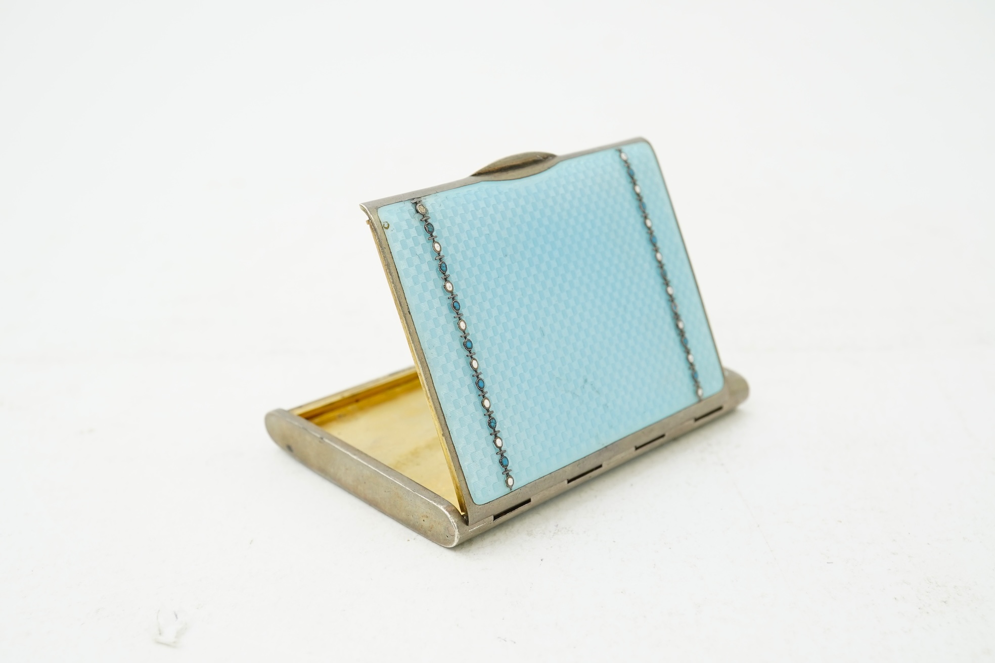 An early 20th century Viennese sterling and blue enamel combination cigarette/vesta case, inscribed Carl Heiss Wien Graben 11